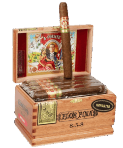 Open wooden box of Arturo Fuente Flor Fina 8-5-8 Natural cigars with one cigar standing upright.