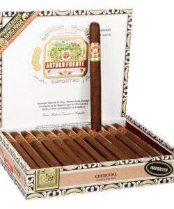 Open box of Arturo Fuente Churchill cigars with one standing upright displaying its brand band.