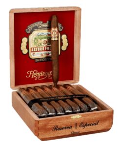 Open wooden box of Arturo Fuente Hemingway Classic cigars with red velvet lining and a single cigar on display.